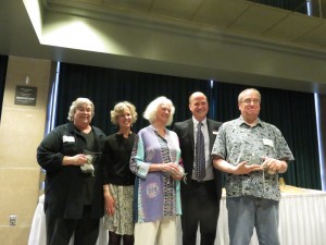 Here the editors of a book of poetry pose with two local library directors who handed out the awards. They won an honorable mention for the book “Amethyst and Agate: Poems of Lake Superior.” From left are: Pamela Mittlefehldt, Carla Powers (Director of the Duluth Library) Mara Hart, Matt Rosendahl (Director of the University Library) and Jim Perlman. (Photo by Naomi Yaeger)
